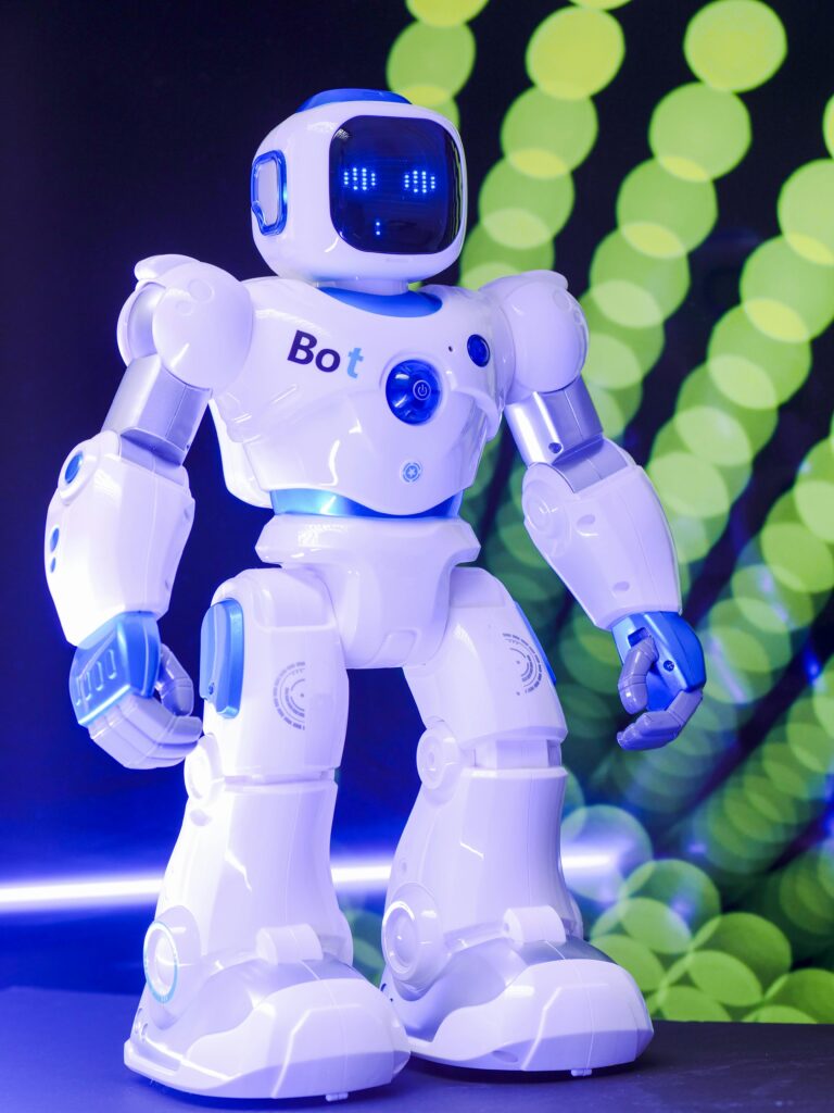 pexels-photo-8566524-8566524 High-tech humanoid robot with glowing LED display and futuristic design.